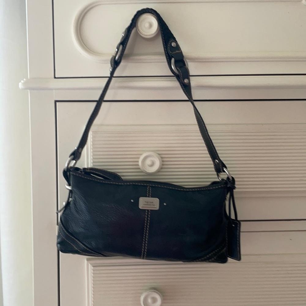 The sack black leather shoulder purse with strap.